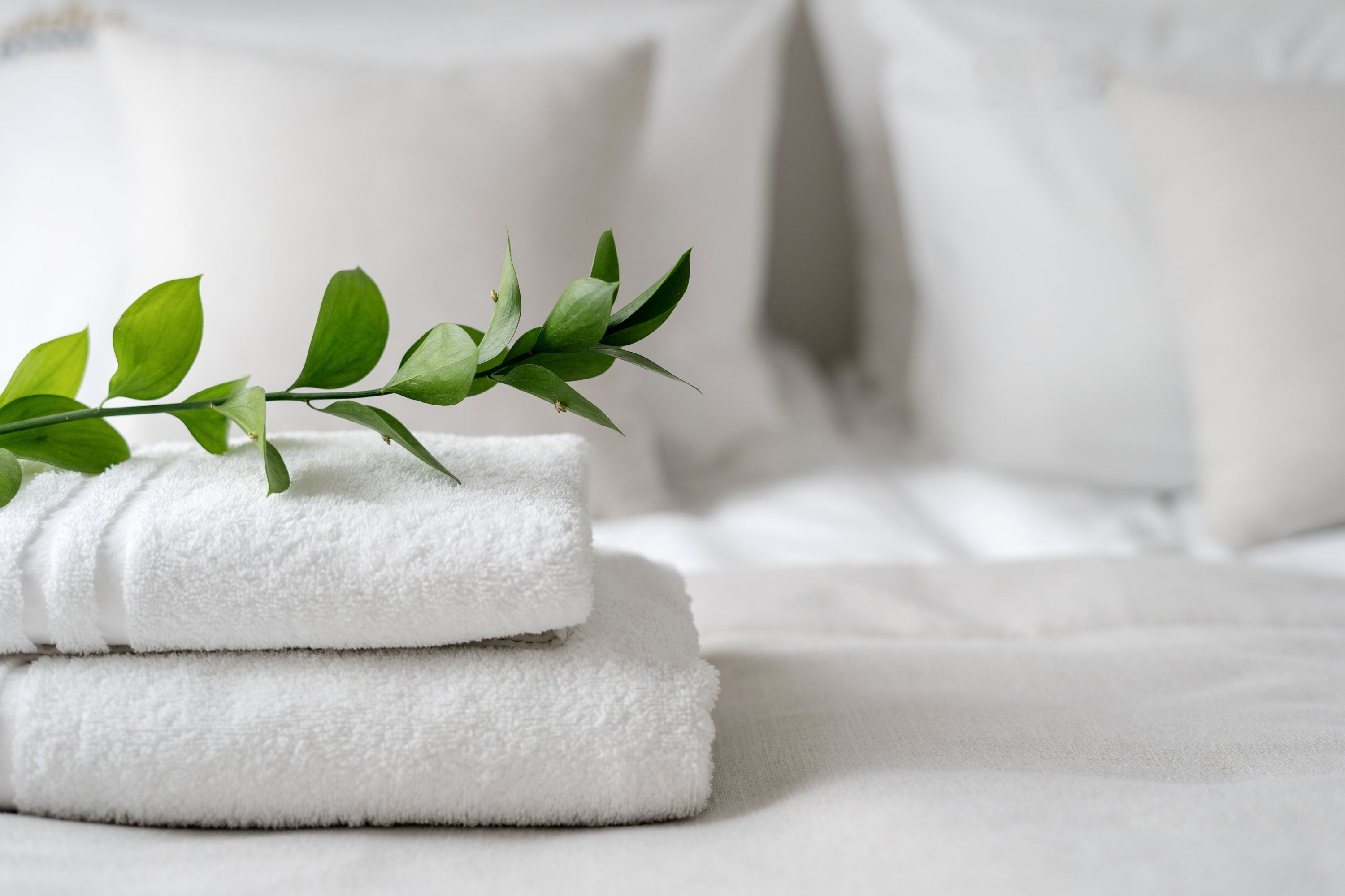 Hotel Linens Green Shutterstock 2204673857